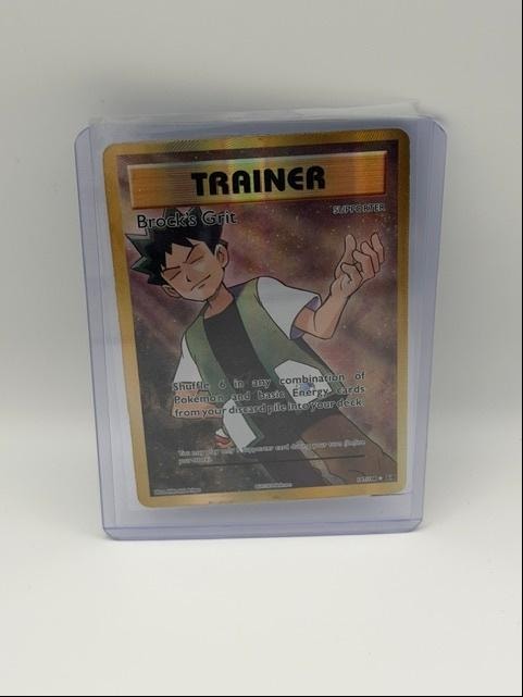 Brock's Grit — Trainer Supporter Reverse Holo
